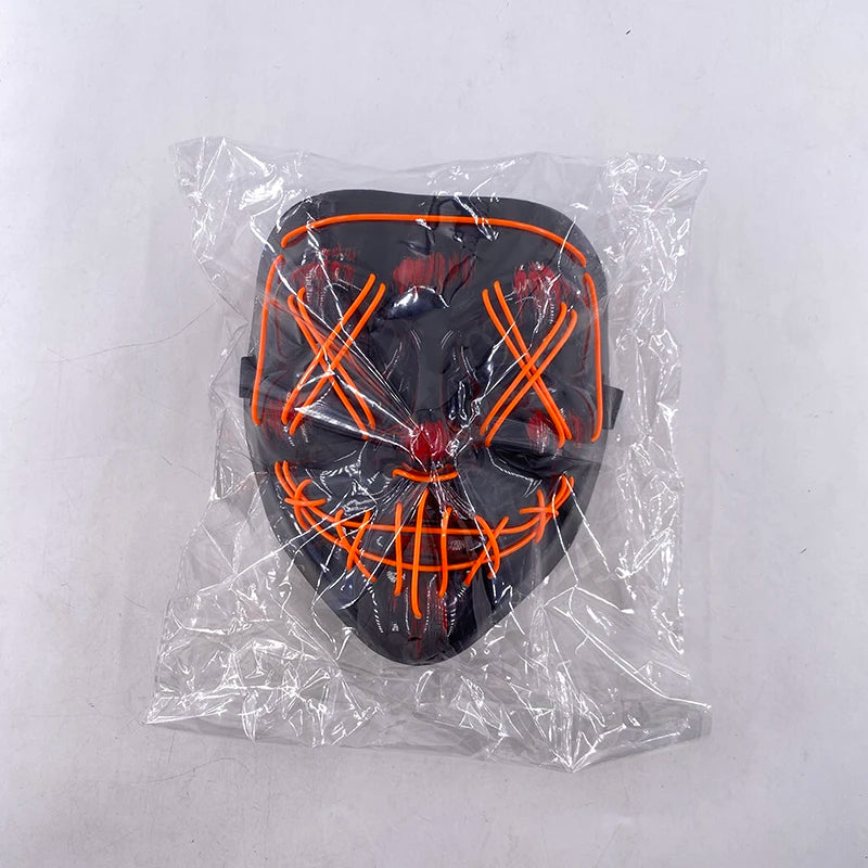 Black mask with orange accents in clear plastic packaging on a white background