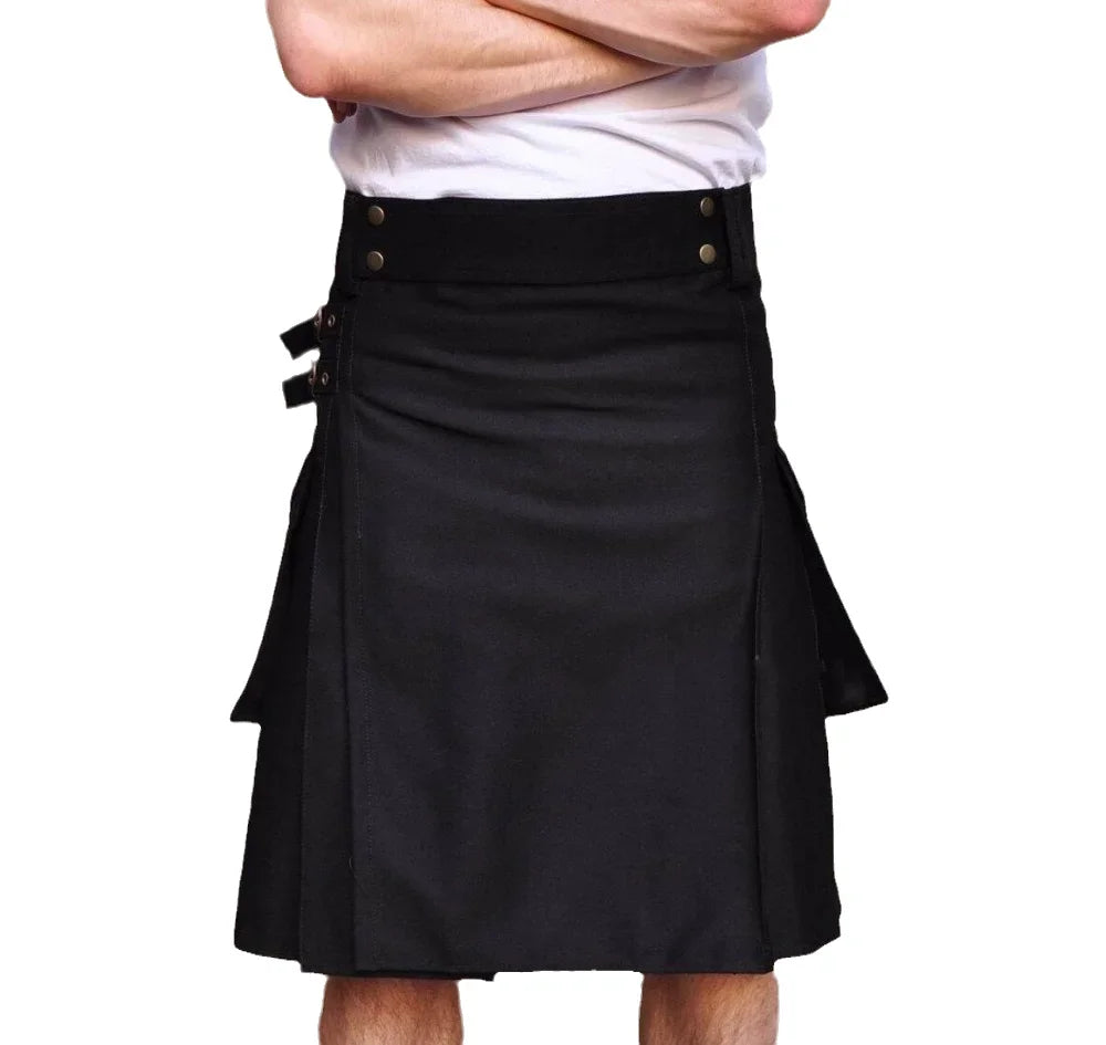 Black kilt worn by a person on a white background