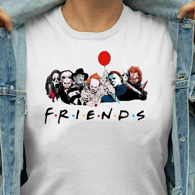 White t-shirt with 'Friends' graphic featuring characters from horror movies, worn by a person.