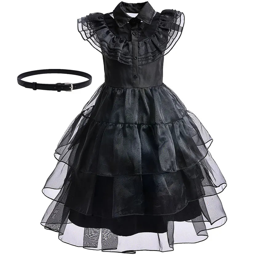 Black dress with ruffled collar and layered skirt on a white background