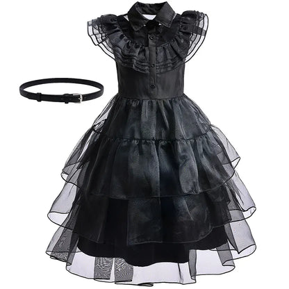 Black dress with ruffled collar and layered skirt on a white background