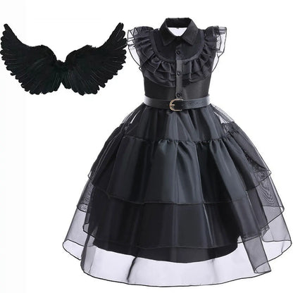 Black dress with ruffled collar and layered skirt, accompanied by black wings on a white background