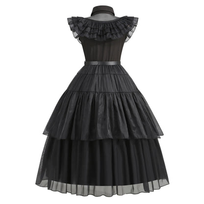 Black tiered dress with ruffled neckline on a white background