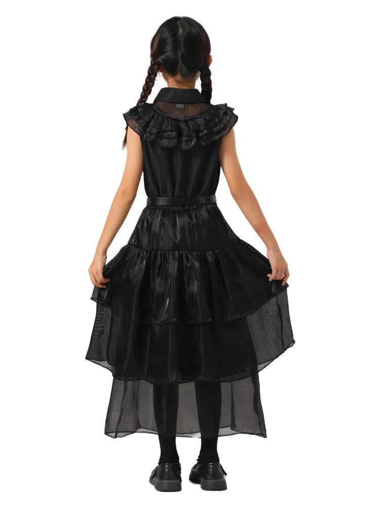 Black dress with ruffled details on a white background