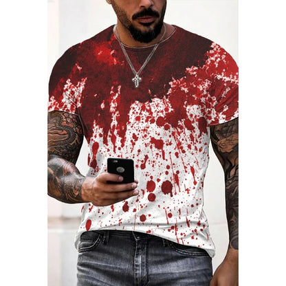 Person wearing a red and white splatter paint t-shirt holding a phone.