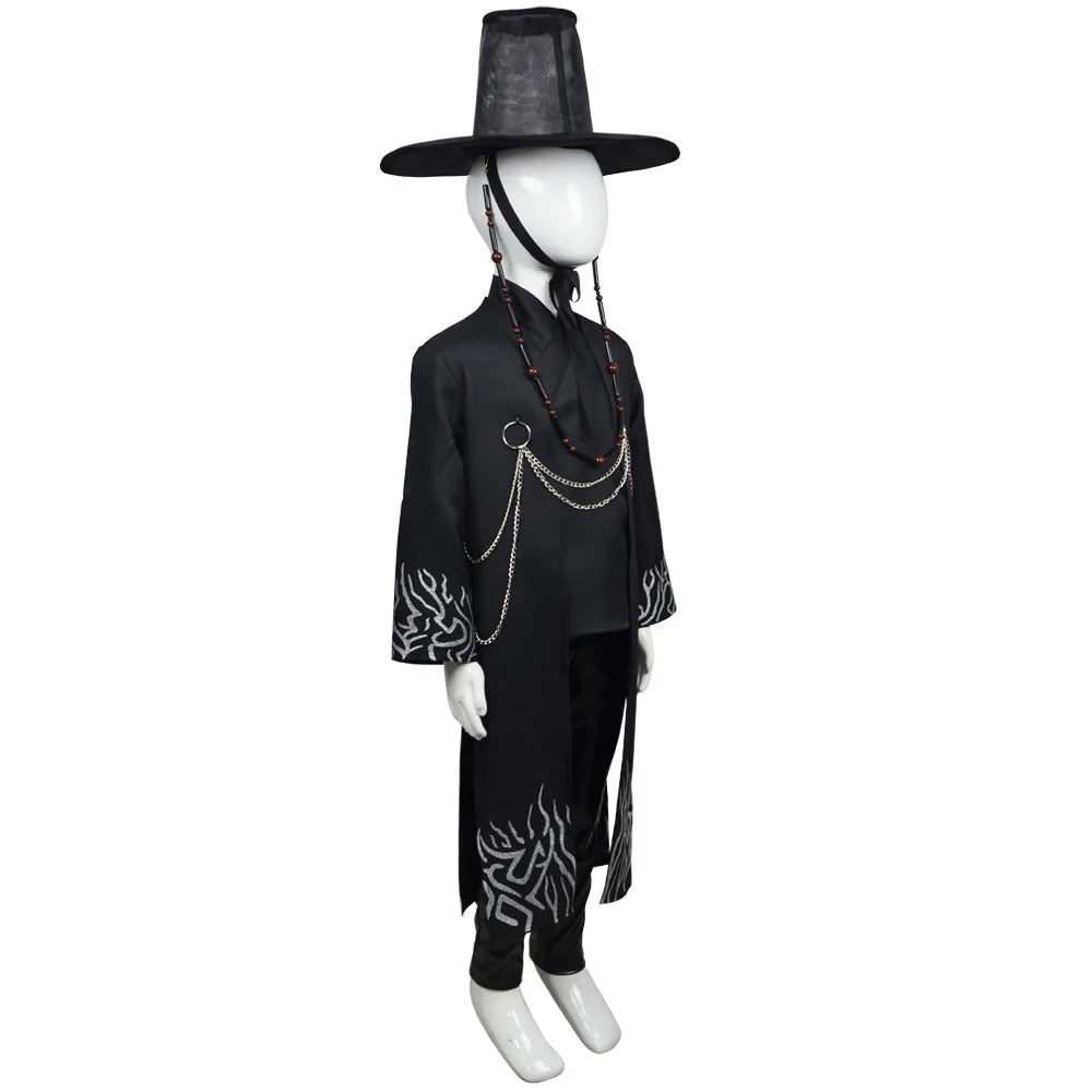 Mannequin wearing a black outfit with intricate designs on a white background