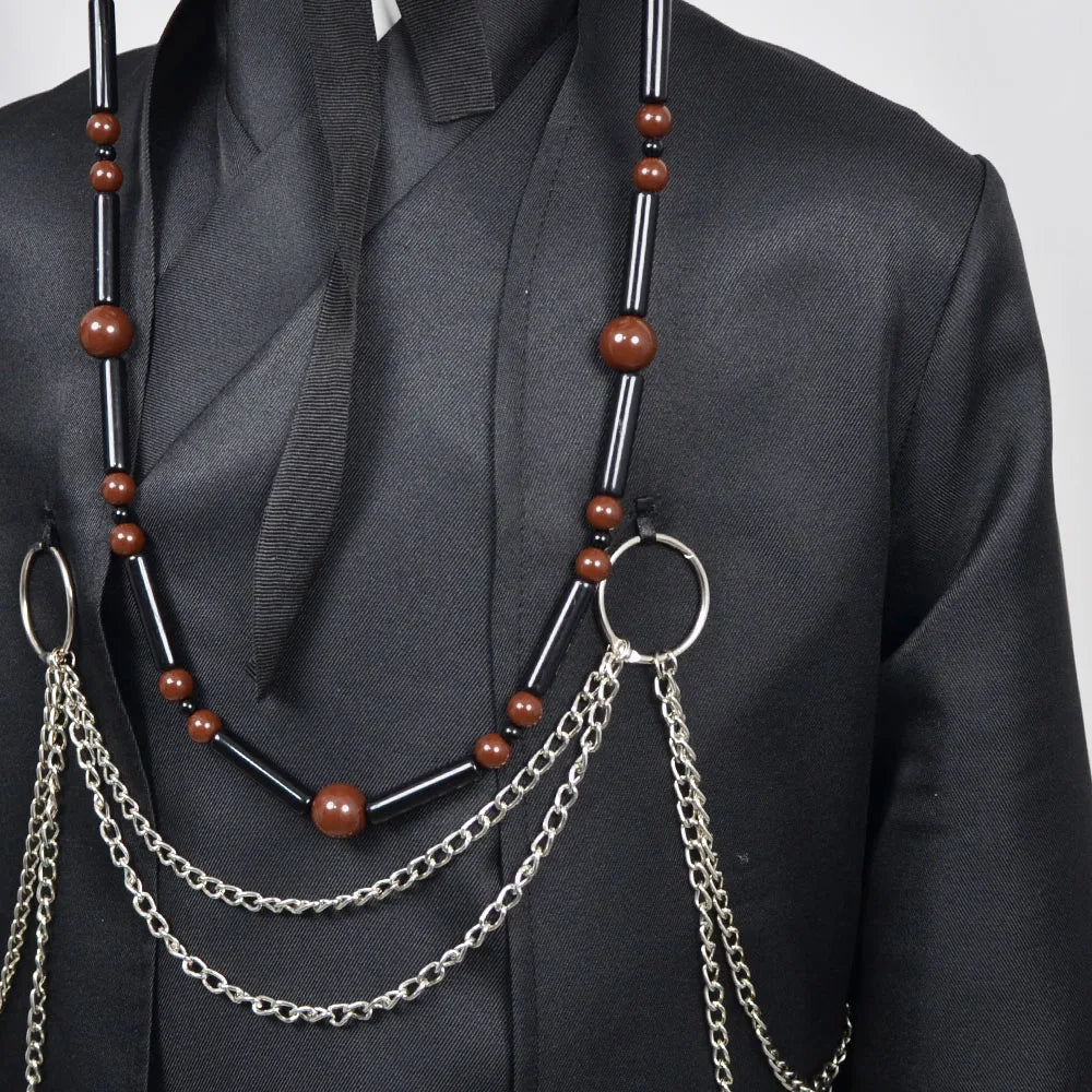 Necklace with brown beads and silver chains on a black outfit