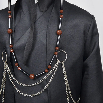 Necklace with brown beads and silver chains on a black outfit