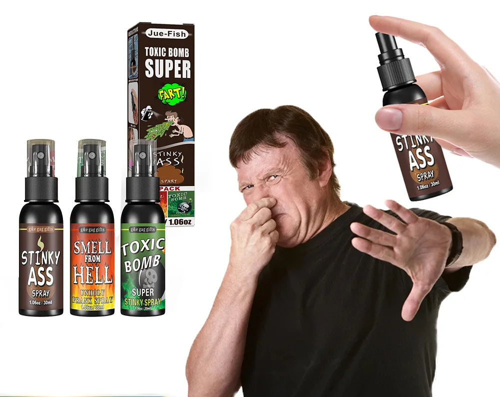 Man reacting to a spray bottle labeled 'Stinky Ass' with packaging and additional bottles in the background.