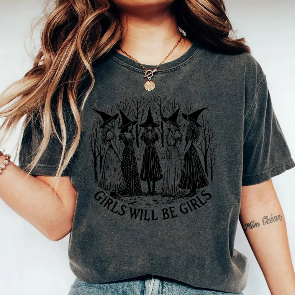 Person wearing a dark gray t-shirt with a graphic design and text.