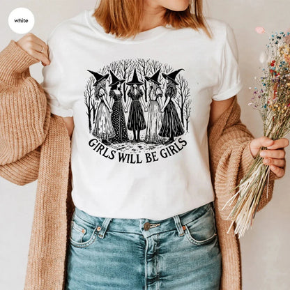 Person wearing a white t-shirt with a graphic design and text, holding dried flowers.