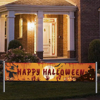 Halloween banner with pumpkins and a scarecrow in front of a house.