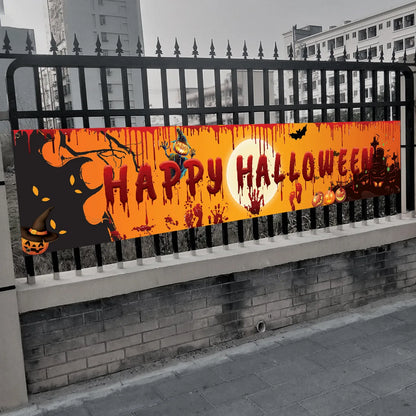 Halloween-themed banner with pumpkins, witches, and 'Happy Halloween' text on a fence.