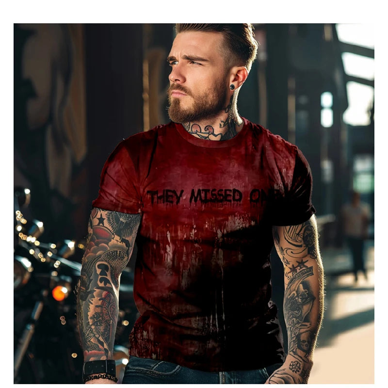 Man wearing a red t-shirt with text, standing on a street.