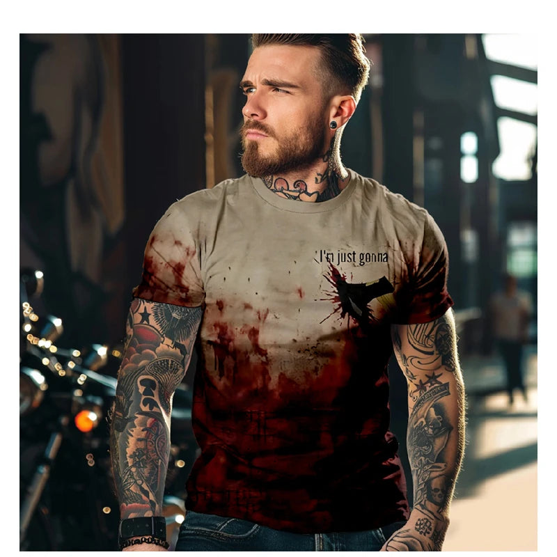 Man with tattoos wearing a t-shirt with graphic design and text.