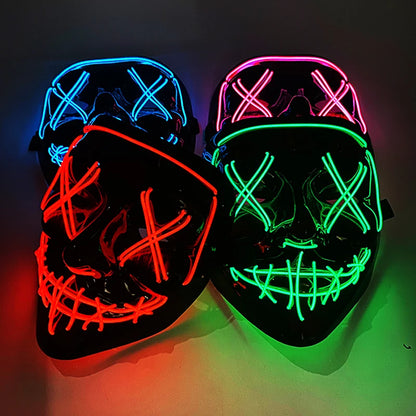 Two LED masks, one red and blue, the other green and pink, on a dark background.