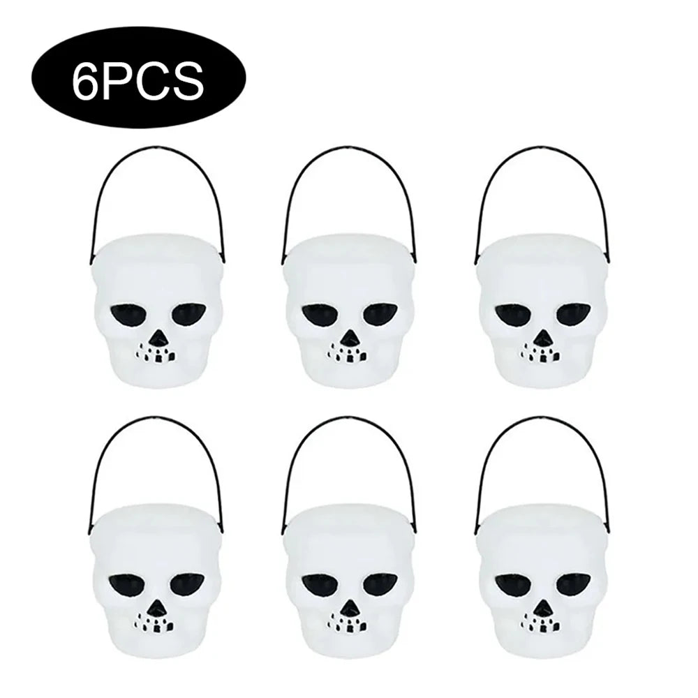 Six Halloween skull buckets with black handles on a white background.