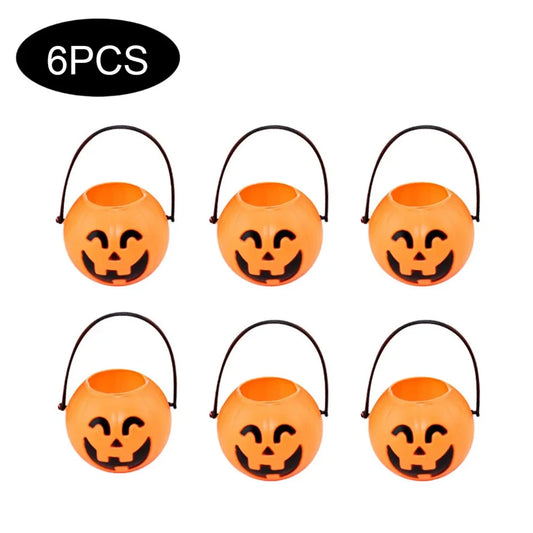 Six Halloween pumpkin buckets with black handles on a white background