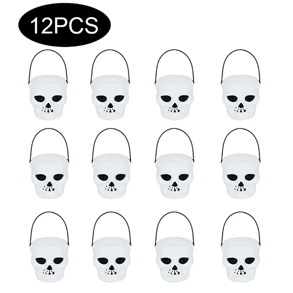 12 white skull-shaped Halloween candy buckets on a white background