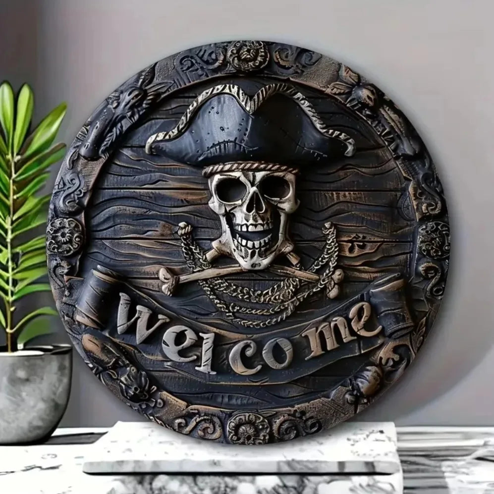 Decorative wall plaque with skull and crossbones design and 'Welcome' text on a neutral background.