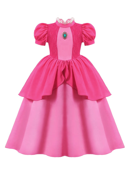 Pink dress with a green gem on a white background