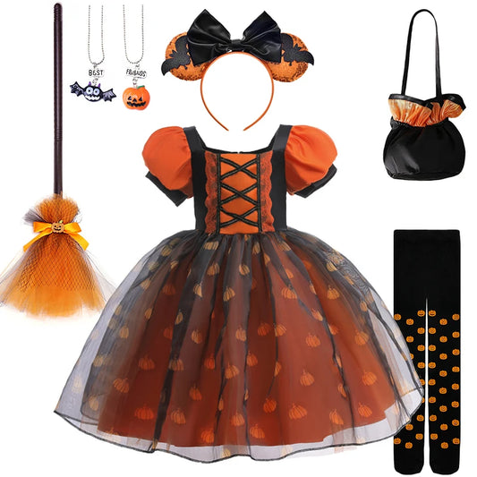 Halloween costume set with dress, headband, bag, broom, and accessories on a white background