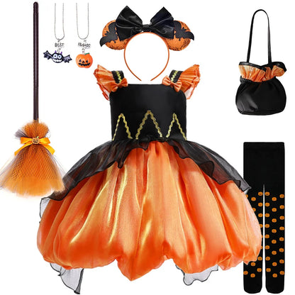 Halloween costume set with dress, headband, bag, broom, and socks on a white background