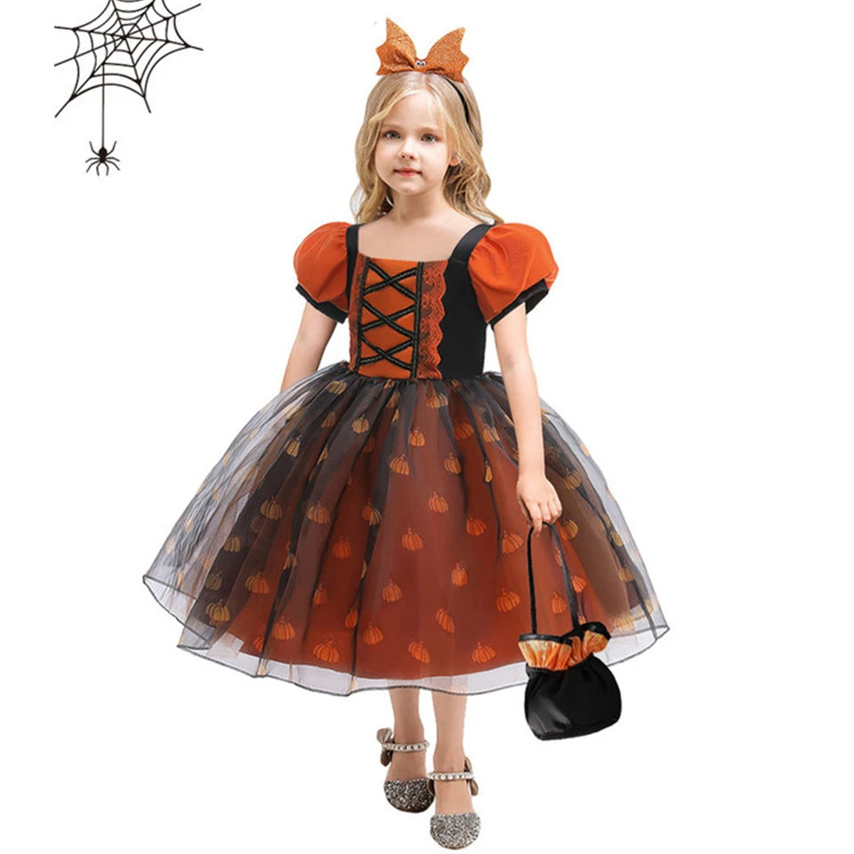 Child in a Halloween-themed dress with pumpkins on a white background