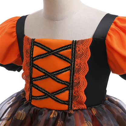 Orange and black dress with lace details on a mannequin against a white background