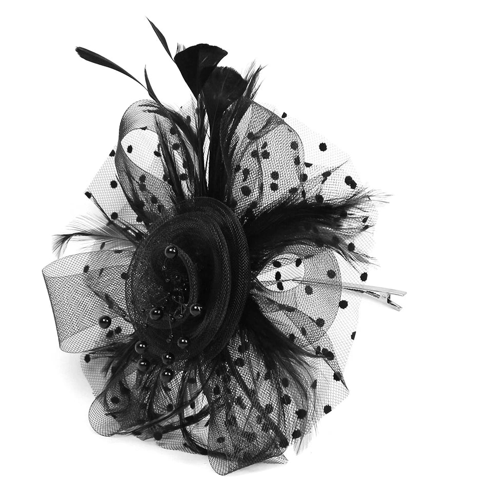Black feathered hair accessory with netting on a white background