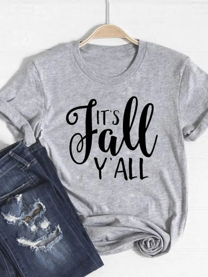Gray t-shirt with 'It's Fall Y'all' text on a hanger with jeans below.