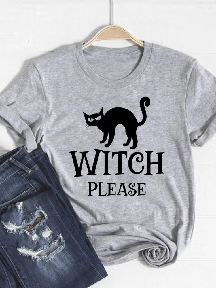 Gray t-shirt with a black cat graphic and 'Witch Please' text on a hanger with jeans below.