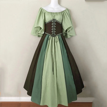Two-tone green and brown dress on a mannequin against a plain background
