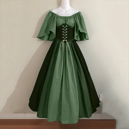 Green off-shoulder dress with corset-style bodice on a mannequin against a beige wall.