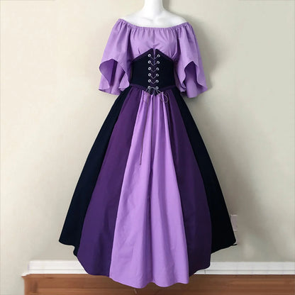 Purple and black dress on a mannequin against a plain background