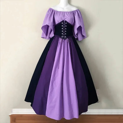 Purple and black dress on a mannequin against a plain background
