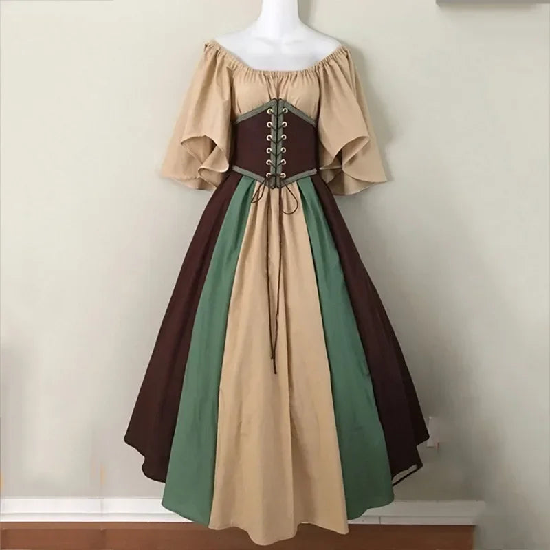 Multicolored dress with a corset on a mannequin against a plain background