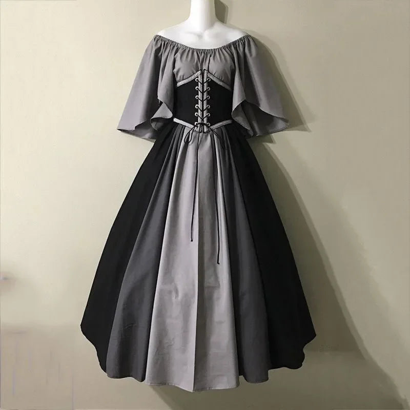 Two-tone gray and black dress on a mannequin against a beige background
